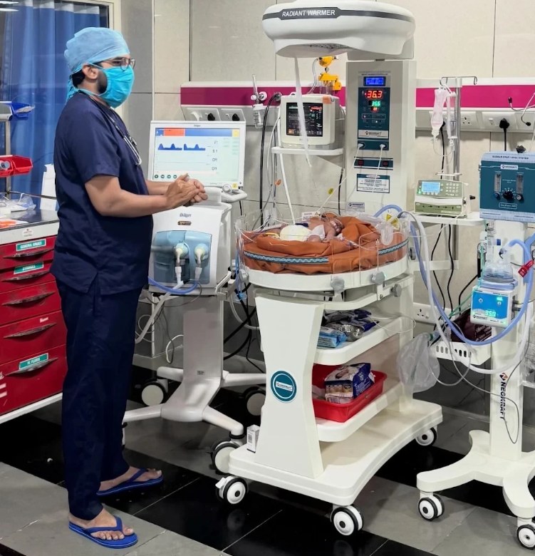 Newborn in the NICU under a radiant warmer