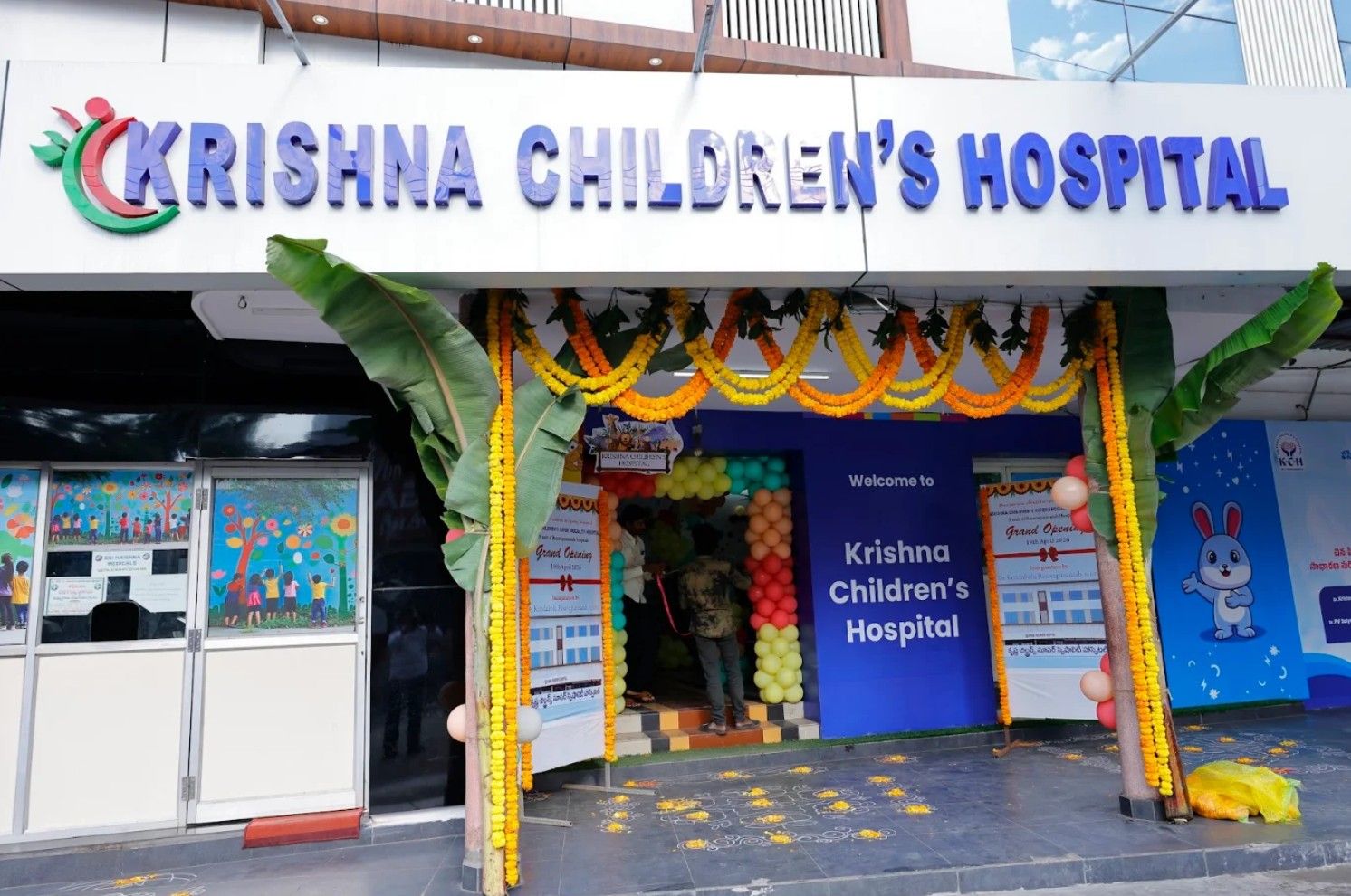 The hospital front decorated with garlands on opening day